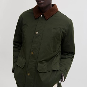 Model wearing Jack & Jones Norrebro Padded Barn Jacket in Rosin with contrast brown corduroy collar and button fastenings