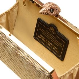 Kurt Geiger beige fabric clutch bag open view, gold-tone frame, crystal embellishment, eagle clasp detail, cream interior with branded plaque
