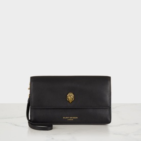 Kurt Geiger black leather crossbody bag with gold eagle clasp, foldover flap, and detachable wrist strap
