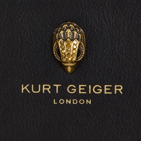 Kurt Geiger Sloane Small Bifold Wallet in black leather, close-up of gold eagle head emblem and gold-foil brand logo