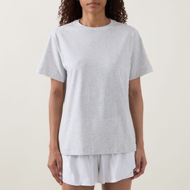 Model wearing Lululemon All Yours T-Shirt in Heathered Core Ultra Light Grey, relaxed fit crew neck tee, styled with matching shorts.