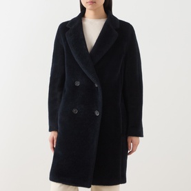 Model wearing Max Mara S midnight blue alpaca wool double-breasted coat with notched lapels and dark buttons, styled with cream top and trousers.