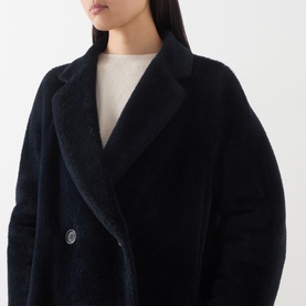 Model wearing Max Mara S midnight blue alpaca and wool blend coat with wide lapels and silver double-breasted buttons, styled with cream top.
