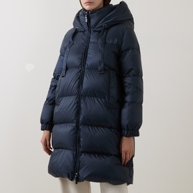 Model wearing Max Mara Cube midnight blue quilted hooded down coat with zip fastening and puffer panels, mid-length silhouette.