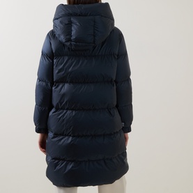 Model wearing Max Mara Cube midnight blue quilted hooded long down coat, rear view showing horizontal quilting and mid-calf length.