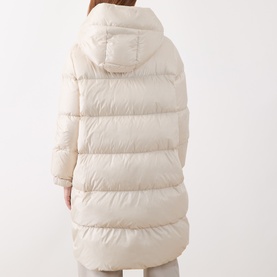 Model wearing Max Mara Cube vanilla quilted hooded down coat, rear view showing horizontal baffle detailing and longline silhouette.