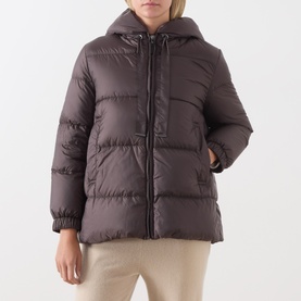 Model wearing Max Mara Cube dark brown hooded puffer jacket with zip fastening, styled with cream trousers.