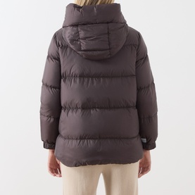 Model wearing Max Mara Cube dark brown hooded puffer jacket, rear view, styled with cream trousers