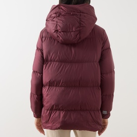 Model wearing burgundy hooded puffer jacket, rear view, quilted panels, relaxed fit, small logo tab at hem
