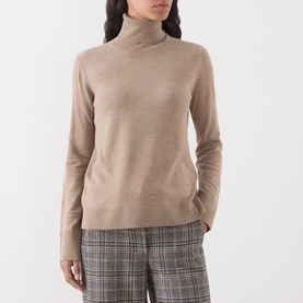 Model wearing Max Mara S Clay Melange wool turtleneck sweater, styled with grey check trousers.