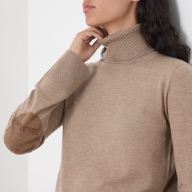 Model wearing Max Mara S Clay Melange wool turtleneck with contrast suede elbow patches, close-up detail view.