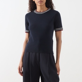 Model wearing Max Mara S Carina Contrast Trim Sweater in ultramarine with contrast trim at neckline and cuffs, styled with black wide-leg trousers.