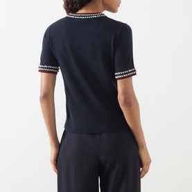 Model wearing Max Mara S Carina Contrast Trim Sweater in ultramarine with multicolour trim at neckline and cuffs, short sleeves, back view