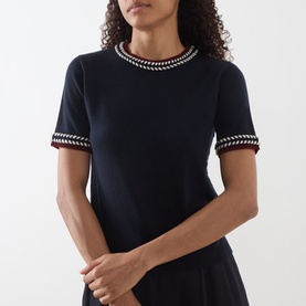 Model wearing Max Mara S Carina Contrast Trim Sweater in ultramarine with multicolour chevron trim at neckline and short sleeves
