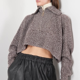 Model wearing Max Mara Sportmax rust blue cropped wool-cashmere knit top with half-zip collar, styled with black leather skirt