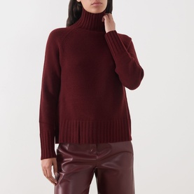 Model wearing Max Mara S Mantova Turtleneck Sweater in bordeaux wool-cashmere with chunky ribbed trims, styled with bordeaux leather trousers.