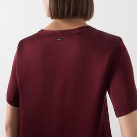 Model wearing Max Mara S Rebecca Solid T-Shirt in Bordeaux, back view showing crew neck, short sleeves, logo label, and smooth finish.