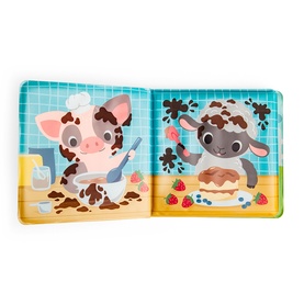 Tiger Tribe magic colour-change book open showing cartoon pig and cow characters in farm scenes, multicoloured illustrated pages