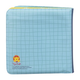 Tiger Tribe multi-coloured book with blue grid-pattern cover, yellow and green binding detail, and small tiger logo