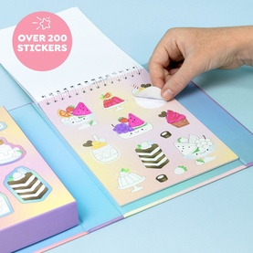 Tiger Tribe multi sticker book open showing cake-themed sticker sheet, hand peeling a sticker; over 200 stickers included