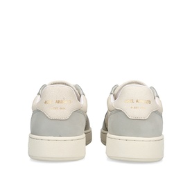 Axel Arigato grey leather low-top trainers, heel view, cream collar and gold branding detail, white rubber sole.