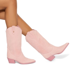 Model wearing Kurt Geiger London pink suede cowboy boots with embroidered shaft, pointed toe, and block heel