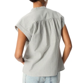 Model wearing Whistles white pinstripe sleeveless top with gathered yoke, styled with light blue jeans, seen from behind.