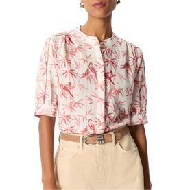 Model wearing Whistles pink floral bird print blouse with elbow-length sleeves, styled with cream wide-leg trousers and woven belt