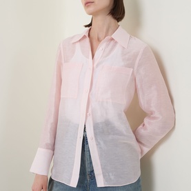 Model wearing Aligne light pink semi-sheer shirt with chest pocket and buttoned cuffs, styled with blue jeans