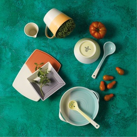 Royal Doulton multi-coloured dinnerware collection including bowls, plates, mug and spoon in sage, terracotta, yellow and grey tones
