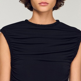 Model wearing Sandro Womens French Dress in black, featuring ruched detail and frayed crew neckline, sleeveless style.