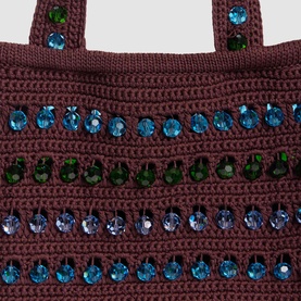 Sandro brown crochet tote bag with rows of blue and green crystal embellishments, close-up detail view.