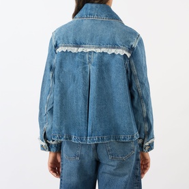 Model wearing Ganni Lace-Trim Denim Jacket in dark blue, rear view showing lace trim detail and knife pleat, styled with matching denim jeans