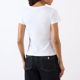 Model wearing Ganni Tiger Logo Baby Tee in Bright White, back view, cropped fit, short sleeves, styled with dark indigo jeans.