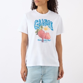 Model wearing Ganni Strawberry Logo T-Shirt in Bright White with strawberry graphic print, styled with light blue jeans.