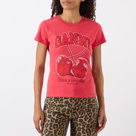 Model wearing Ganni Cherry Logo Baby Tee in High Risk Red with crew neck, cherry graphic print, styled with leopard print trousers.