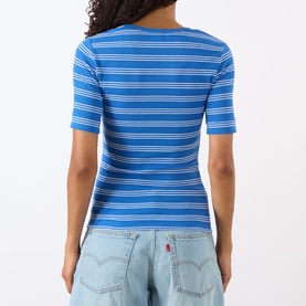 Model wearing Ganni Butterfly Logo Striped T-Shirt in Nouveau Navy, ribbed cotton with short sleeves, styled with light wash jeans, back view.