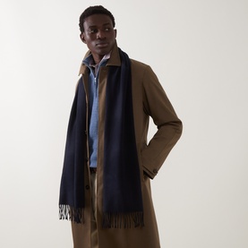 Model with Gant Evening Blue wool fringed scarf, styled with a tan overcoat and light blue shirt
