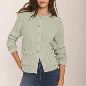 Model wearing Mint Velvet Bobble Detail Knitted Cardigan in green with crew neck, patch pockets and bobble trim, styled with blue jeans
