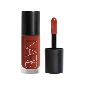 NARS Liquid Blush in Itsy Bitsy, terracotta-toned formula shown in open black bottle with doe-foot applicator wand