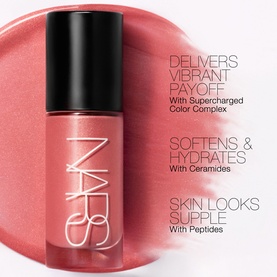 NARS Blush in Itsy Bitsy, a coral-pink liquid formula in black bottle, with benefit callouts for colour, ceramides and peptides.