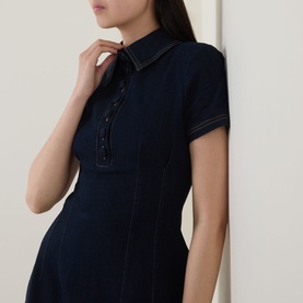 Model wearing Odd Muse dark blue short-sleeve shirt dress with contrast stitching, button placket, and fitted silhouette