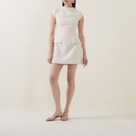 Model wearing Odd Muse Tweed Flap Pocket Mini Dress in cream, with cap sleeves, flap pockets and voluminous mini skirt, styled with nude heeled