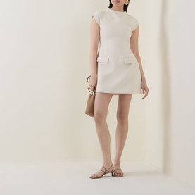Model wearing Odd Muse Tweed Flap Pocket Mini Dress in cream, styled with nude strappy sandals and a tan clutch bag.