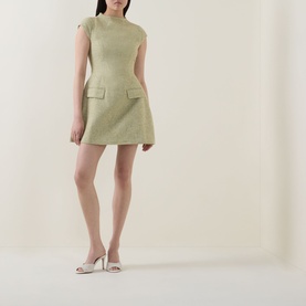 Model wearing Odd Muse Tweed Flap Pocket Mini Dress in green with cap sleeves and flap pockets, styled with cream heeled mules.