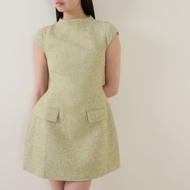 Model wearing Odd Muse Tweed Flap Pocket Mini Dress in green, featuring cap sleeves, high round neckline and front flap pockets.