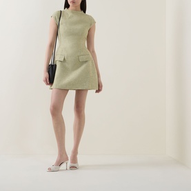 Model wearing Odd Muse Tweed Flap Pocket Mini Dress in green with cap sleeves and flap pockets, styled with white heels and black mini bag.