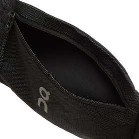 On Running black belt bag shown open, revealing inner zip compartment, in lightweight mesh fabric with logo detail