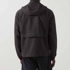 Model wearing On Running Casual Jacket in Espresso, rear view showing hood, kangaroo pocket, and lightweight shell fabric.
