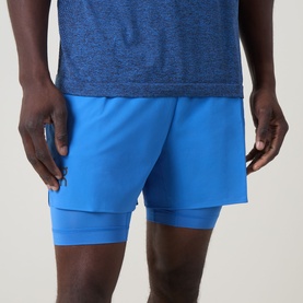 Model wearing On Running Jay Heather performance shorts with layered brief lining, styled with a navy marl t-shirt.